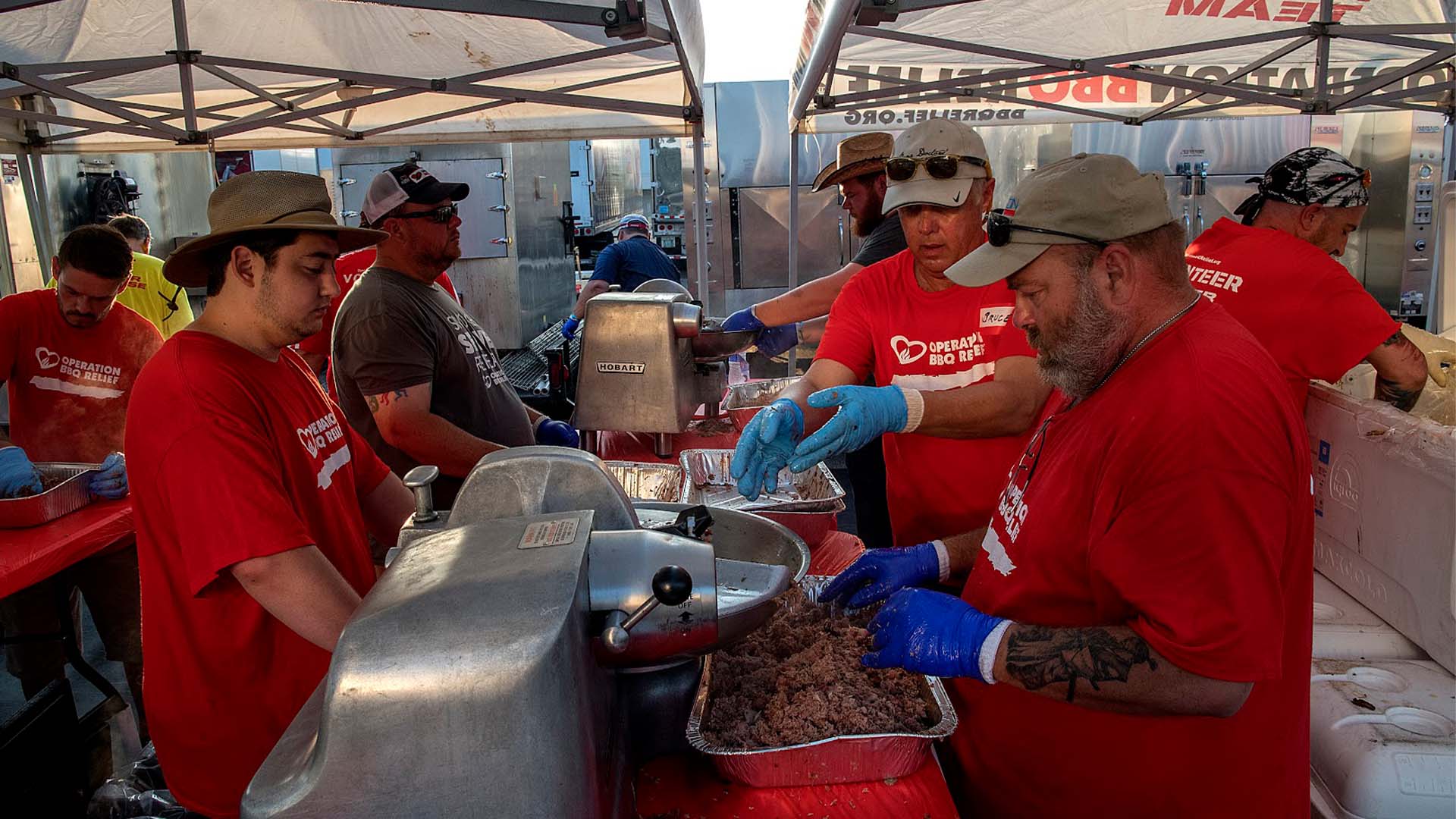 Teams with Operation BBQ Relief cook a meal after being deployed.